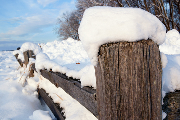Wooden fencepost in snow at DNR Hill in Horicon Marsh, Joel Nisleit Photography.