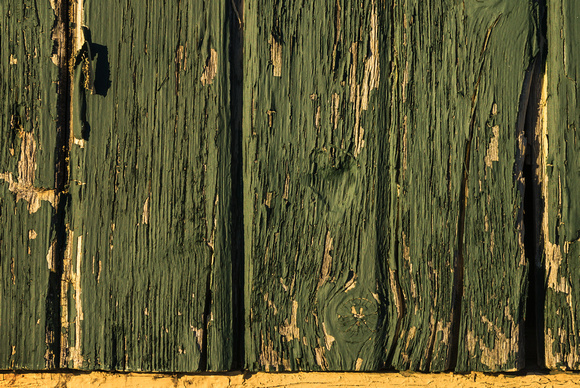 Painted wood shows its wear on the side of a pavilion in Discher Park, Horicon, Wisconsin.